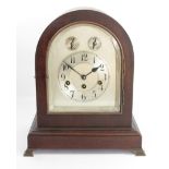 An Edwardian mahogany chiming and striking mantle clock, the silvered dial with subsidiary chime/