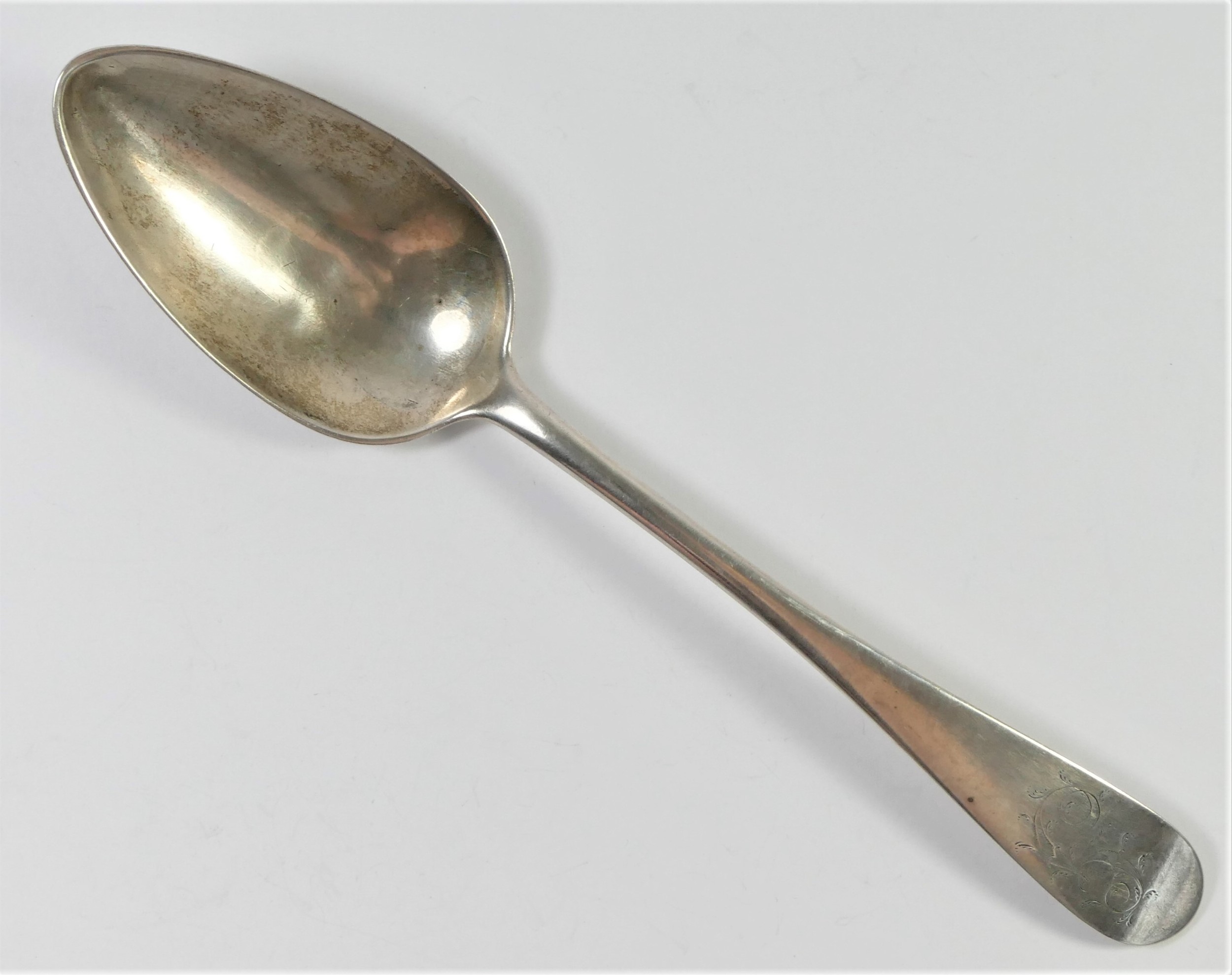 A George III silver Old English pattern table spoon, makers mark JWE, thrice, untraced, possibly