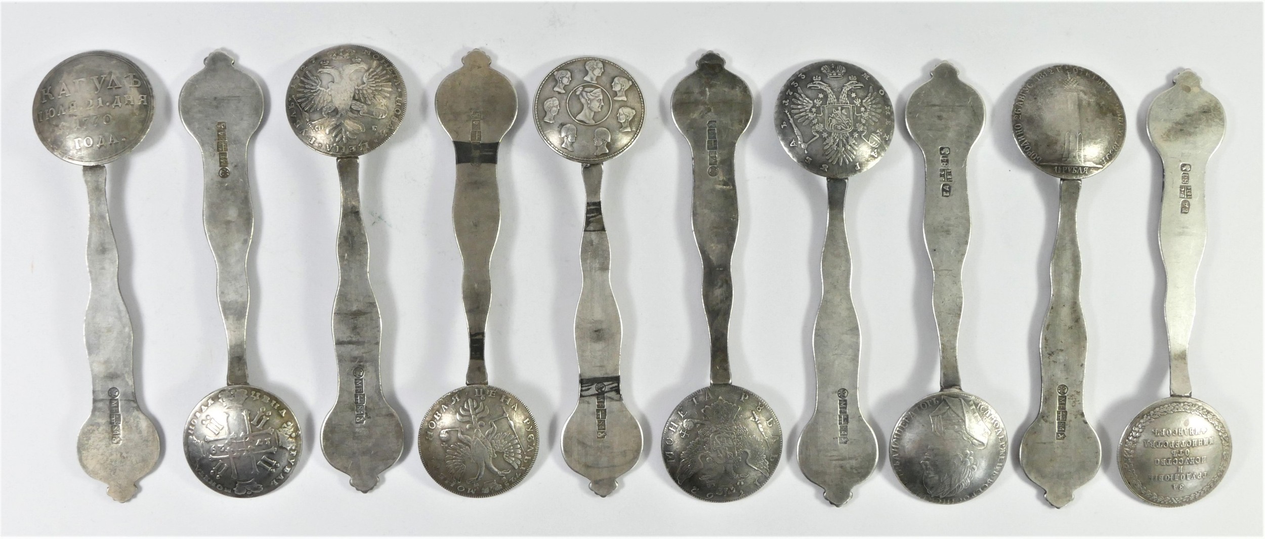 A base metal set of ten Russian style coin spoons, bearing pseudo silver hallmarks, each with a - Image 2 of 3