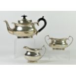 A silver three piece bachelors tea service, Brrm 1923, of oral baluster form, 653gm.