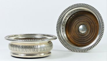A silver pair of bottle coasters, by Mappin & Webb, Birmingham 1967 with pierced and chased