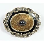 A Victorian gold, enamel and cabochon garnet mourning brooch, inscribed "In memory of George