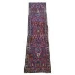 A Persian Sarouk runner with multicoloured floral decorations, 280 x 80 cm