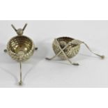 A Victorian pair of electroplated novelty salt pots, in the form of crossed hockey sticks with a