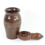 A lignum vitae nut cracker, with screw action, 16cm, together with a lignum vitae tapering vase,