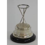 A silver golfing presentation trophy, Birmingham 1937, composed of three crossed clubs with a band
