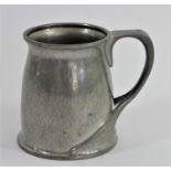 Oliver Baker for Liberty & Co., a Tudric planished pewter tankard, glass base, base marked Made in