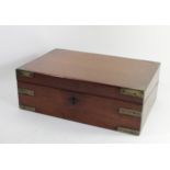 A brass bound mahogany campaign writing slope, circa 1880s, having hinged lid, opening to reveal
