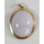 A .585 gold mounted cabochon mauve jade (untested) pendant, 26 x 21mm