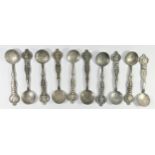 A base metal set of ten Russian style coin spoons, bearing pseudo silver hallmarks, each with a