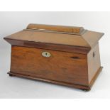 A Victorian rosewood sarcophagus tea caddy, hinged lid revealing two tea compartments with hinged