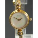 Gucci, a gilt metal ladies bangle wristwatch, ref 2700.2.L