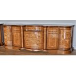 An Italian burr walnut and satinwood buffet/sideboard, serpentine frontage accented with shell and