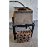 A cast iron metal bar former, 31 x 31cm, various size/shape holes, mounting block, purpose built