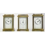 Three brass cased manual wind carriage clocks, two French and one English with 8 day movements. (3)