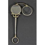 A pair of low grade silver gilt lorgnettes, unmarked, 14cm, case