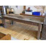 A substantial pitch pine 'Country Kitchen' dining table, late 19th/early 20th Century, having cut