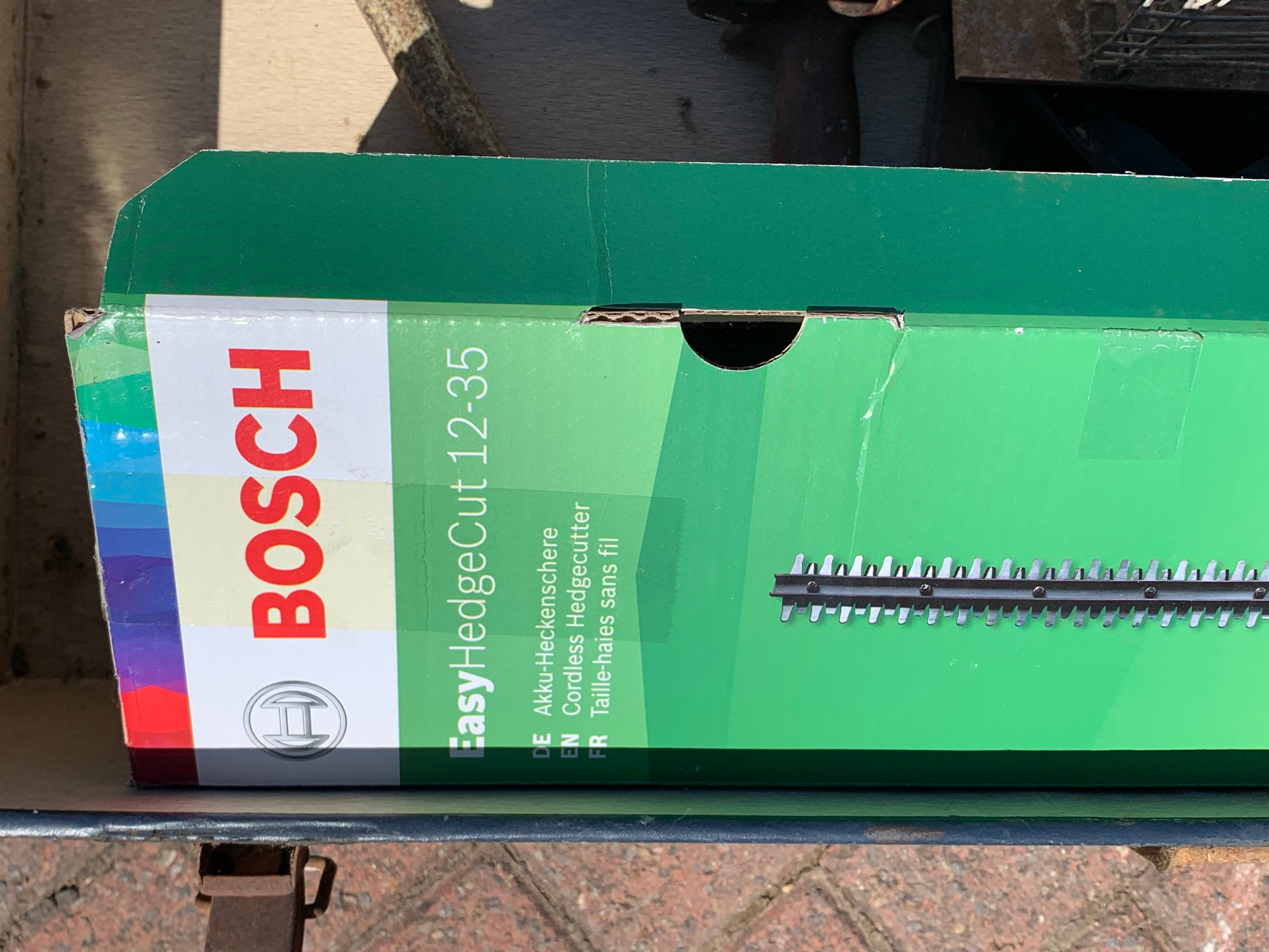 A Bosch Easy Hedge Cut 12-35 hedge trimmer, boxed, together with hand saws and a animal trap, in a - Image 3 of 3