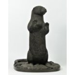 A bronze coated resin sculpture of a standing otter, by Richard Fisher (Keswick) stamped to base, lt