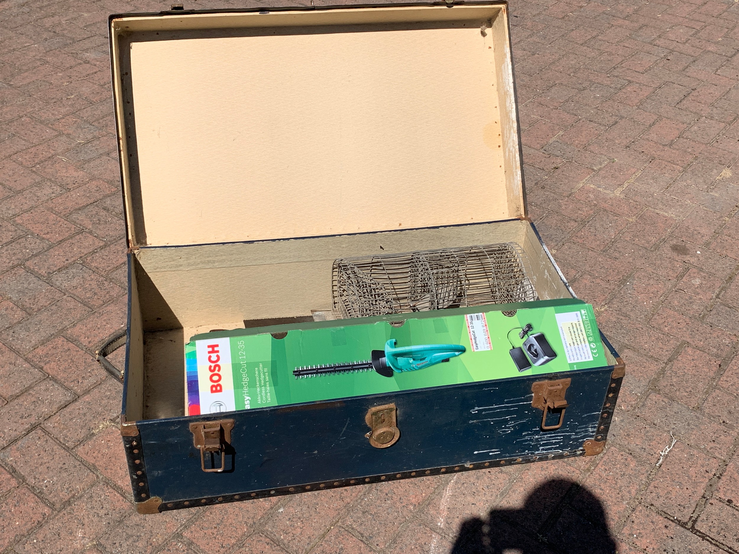 A Bosch Easy Hedge Cut 12-35 hedge trimmer, boxed, together with hand saws and a animal trap, in a - Image 2 of 3