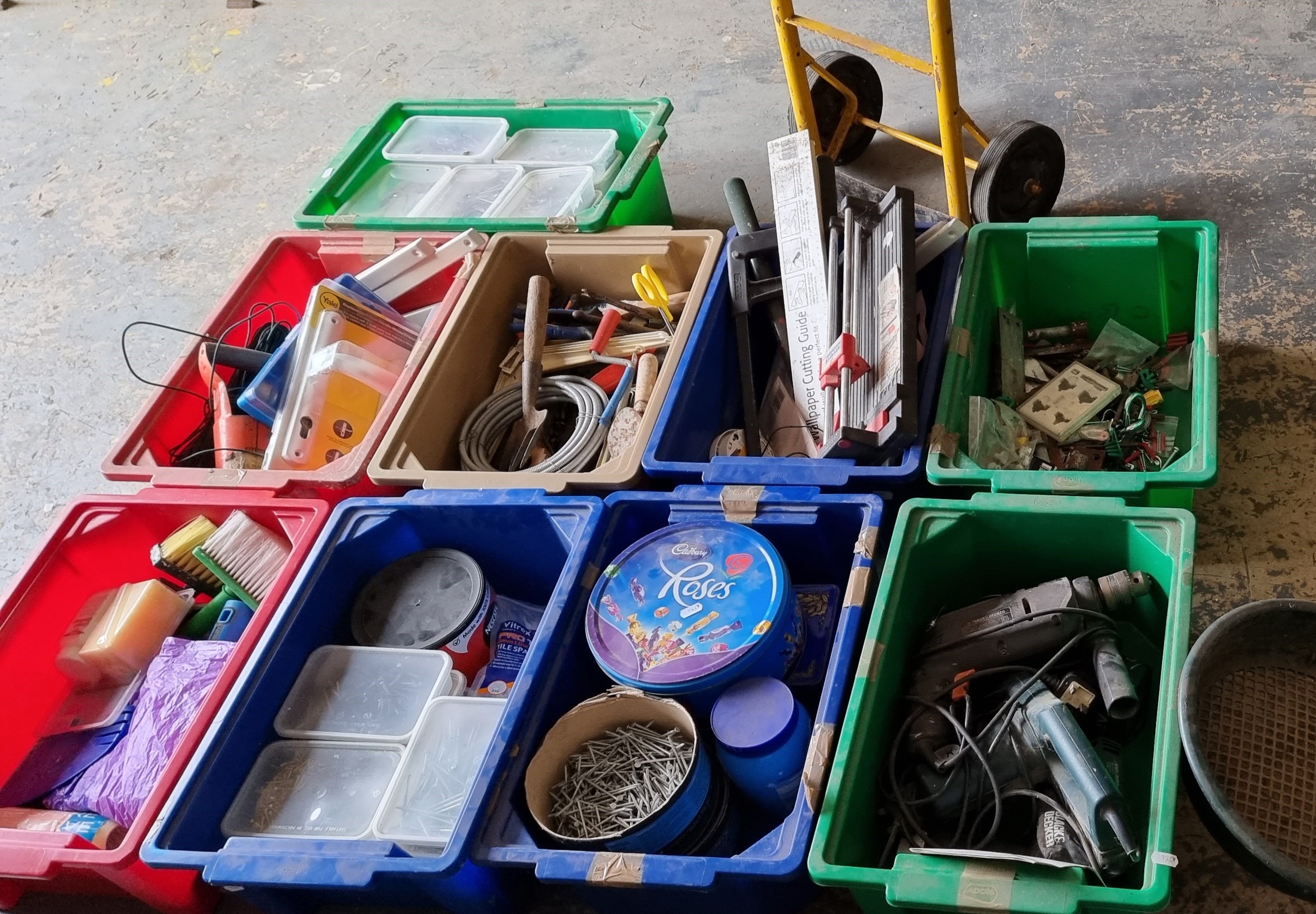 A large quantity of general tools, including hammers, nails and a trolley