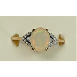 A 9ct gold facetted opal and diamond dress ring, 10 x 8mm, U, 2.2gm