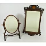 An Edwardian wall mirror, mahogany framed fretwork inlaid with central motif, bevel edged glass,