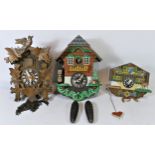 Three mid 20th Century German made mechanical cuckoo clocks.