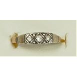 A 9ct gold and three stone white sapphire ring, I 1/2, 1.4gm