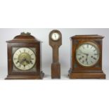 A 1950s English Westminster chime bracket clock, 30cm tall, together with an oak cased manual wind