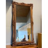 A substantial wall mirror, having carved & moulded wood frame. 82x152cm