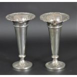 A pair of silver vases, by Walker & Hall, Sheffield 1926, 17cm, loaded