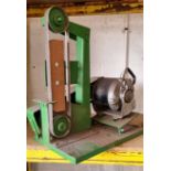 A bench mounted belt sander, 54cm high