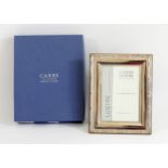 A silver photograph frame, with ribbon and reed border, by Carrs, London 2007, 18 x 14cm, unused,