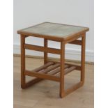 A Danish teak tile top occasional table, c1960s, with slatted shelf under, 45cm square, 50cm tall.