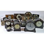 A collection of mid 20th Century bakelite cased mantel clocks, manual wind and electric, together