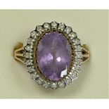 A 9ct gold amethyst and diamond cluster ring, 14 x 10mm, Q, 4.9gm