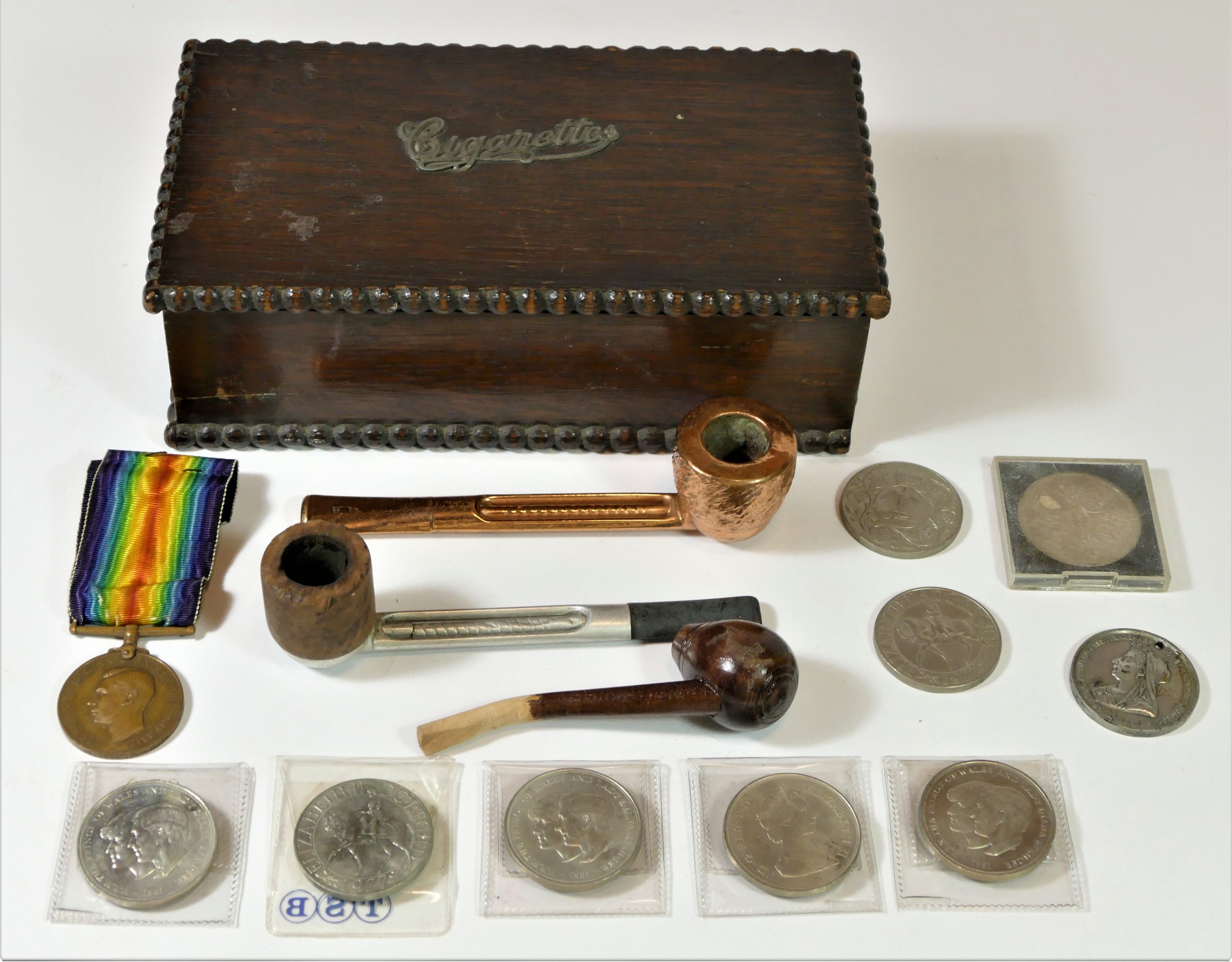A mid 20th Century oakcased cigarette box & contents, to include a 'Faithful Service' medal,
