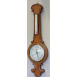 A late 19th Century banjo mercury barometer, mahogany carved leaf scroll case, silvered dial,