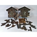 An early 20th Century Black Forest mechanical cuckoo clock, together with a later example, for