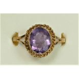 A 9ct gold and amethyst ring with rope border, P, 2.7gm
