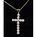 A 9ct gold and diamond cross pendant, 32mm, chain, 2.5gm