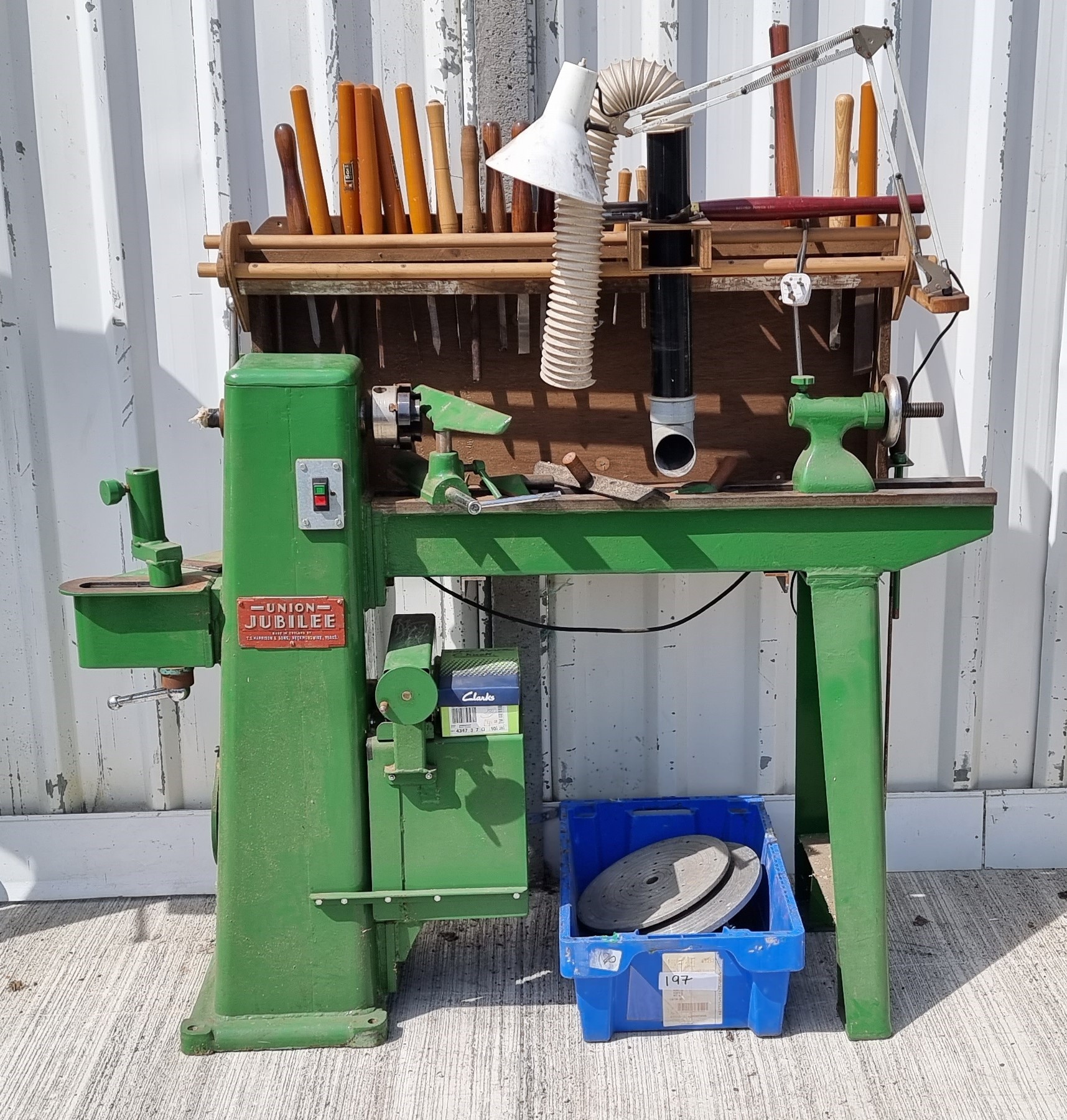 A Junior Jubilee three phase lathe, with various wood turning attachments and a selection of