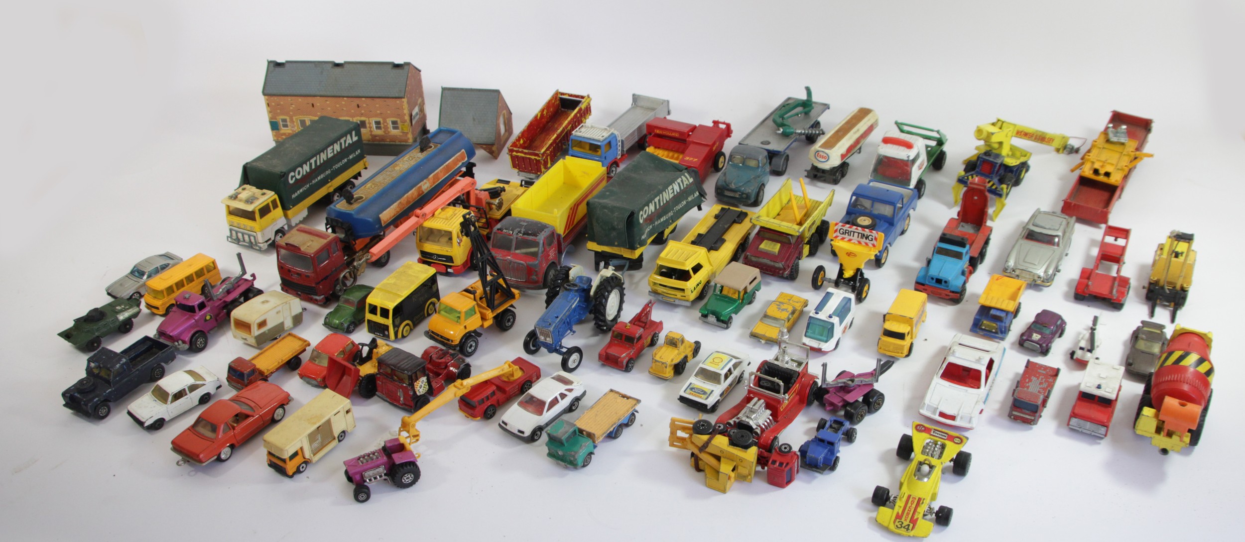 A collection a die-cast vehicles to including brands such as Corgi, matchbox, Britain's and others