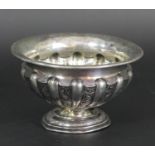 A silver embossed pedestal bowl, Birmingham 1910, diameter 10.5cm, 58gm, foot A/F