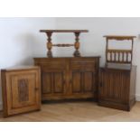 An oak 'Old Charm' sideboard cupboard, comprising of two drawers over two hinged panel cupboards,