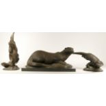 A group of three bronze coated resin otter sculptures, to include a seated otter on marble base,