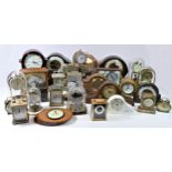 A collection of mantel clocks, to include Smiths manual wind and a selection of anniversary