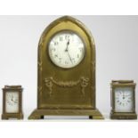 Two miniature carriage clocks, brass cased with bevel edge glass panels, white enamel dials with