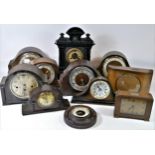 A collection of manual wind mantel clocks, quartz carriage clocks and anniversary clocks in three